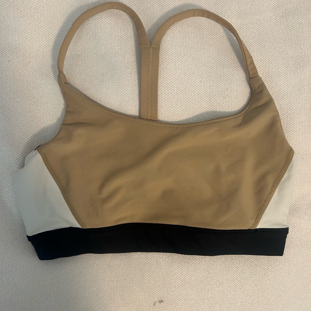 Light Beige Athletic Top with Racerback Design and Supportive Black Band